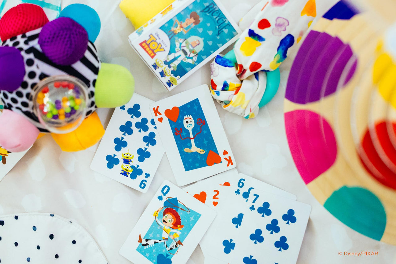Disney characters themed bicycle playing cards deck featuring colorful illustrated cards by The United States Playing Card Company.